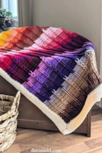 Jacob’s Colorful Cables Crochet Baby Blanket from Dana Nield Designs