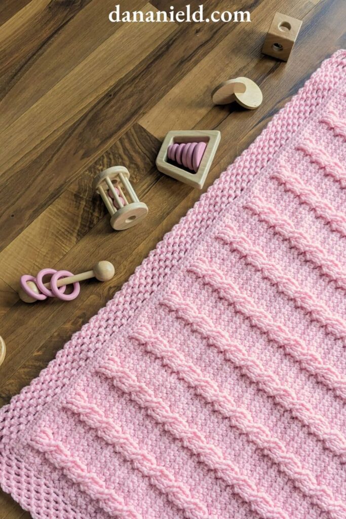 Crossed Towers Cable Crochet Baby Blanket from Dana Nield Designs